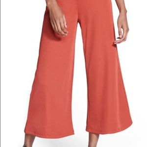 Nike Ribbed Crop Pants In Firewood Orange/ Black